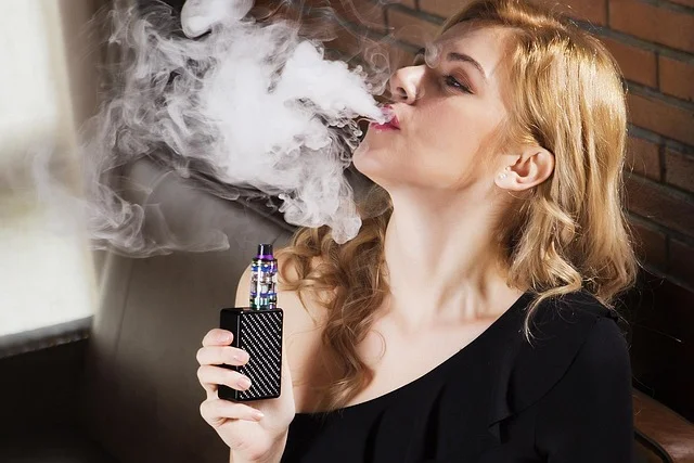 how many people vape - A diverse group of people using various vaping devices